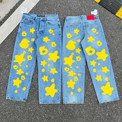 sp5der Yellow Star & Number‑6 Print Light‑Wash Baggy Jeans